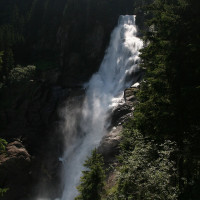 Photo: Pom1803 / Wikimedia Commons / CC BY-SA 3.0 AT / https://commons.wikimedia.org/wiki/File:Krimmler_Wasserf%C3%A4lle.jpg / Usage: Commercial reuse allowed under CC BY-SA 3.0 AT. Image depicts the Krimml Waterfalls directly adjoining and integrated with the Krimml Worlds of Water visit; documented as same-attraction-complex representative rather than a building photo.